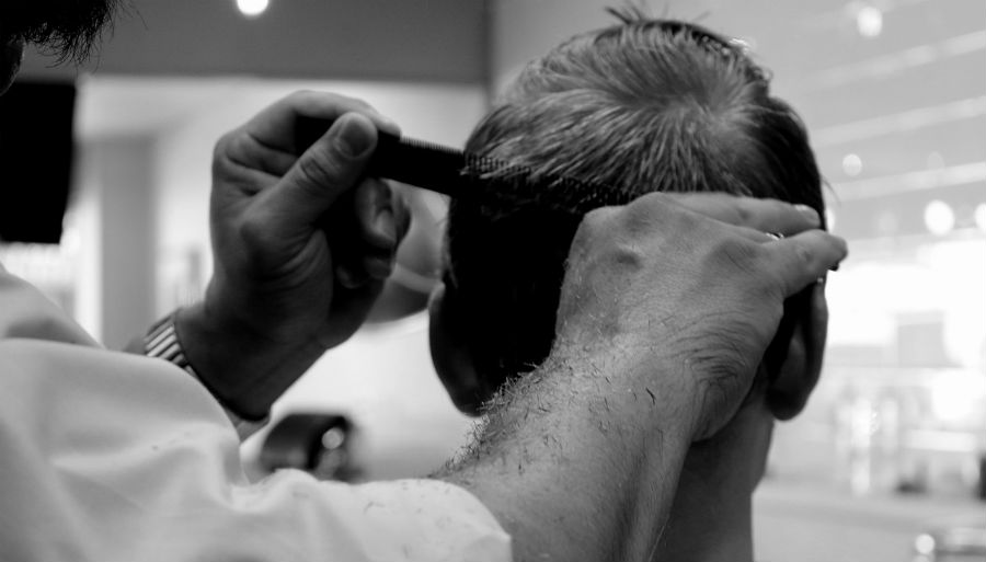 barber working on hair cut
